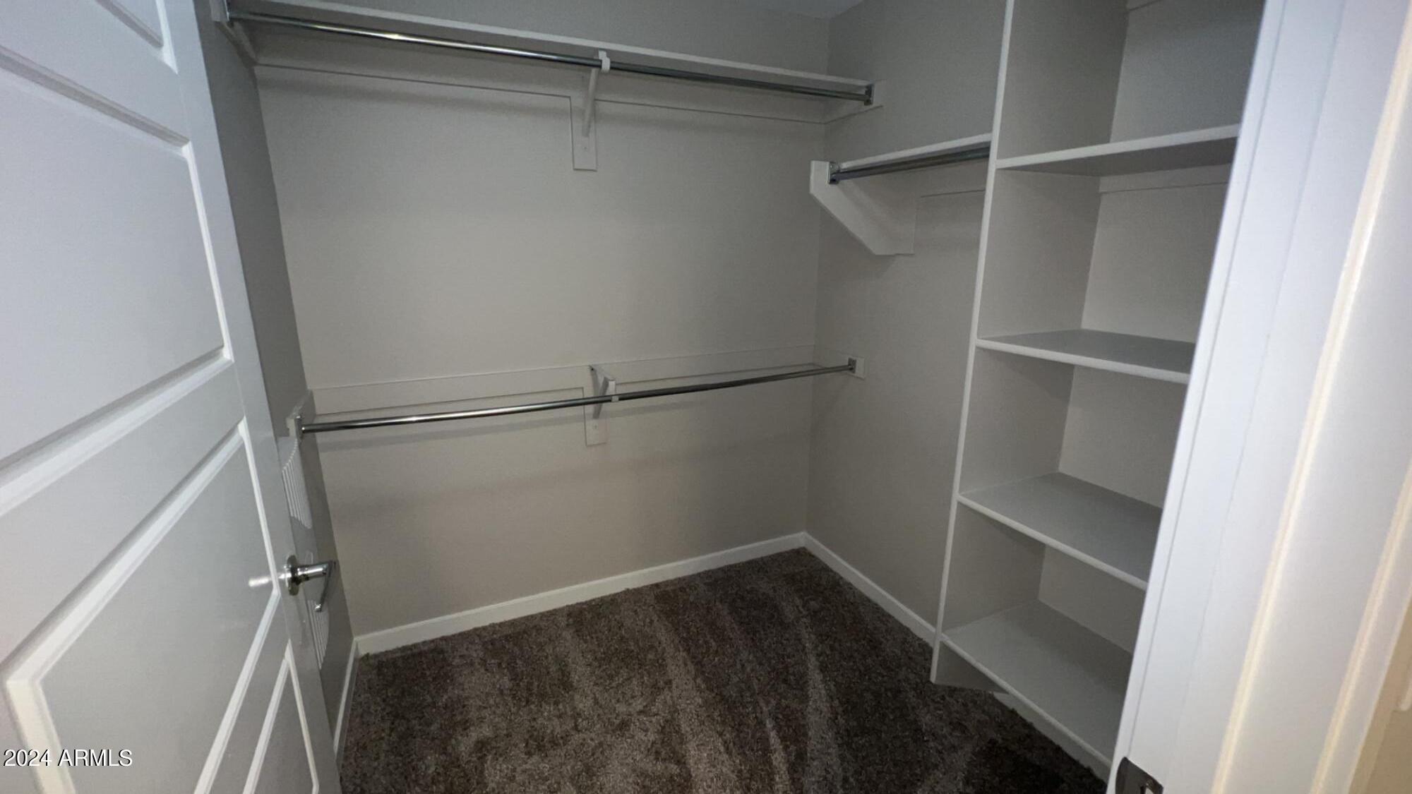 4949 North 7th Street, Unit A3 Phoenix, AZ 85014 - Photo 6 of 22 a view of an empty walk in closet