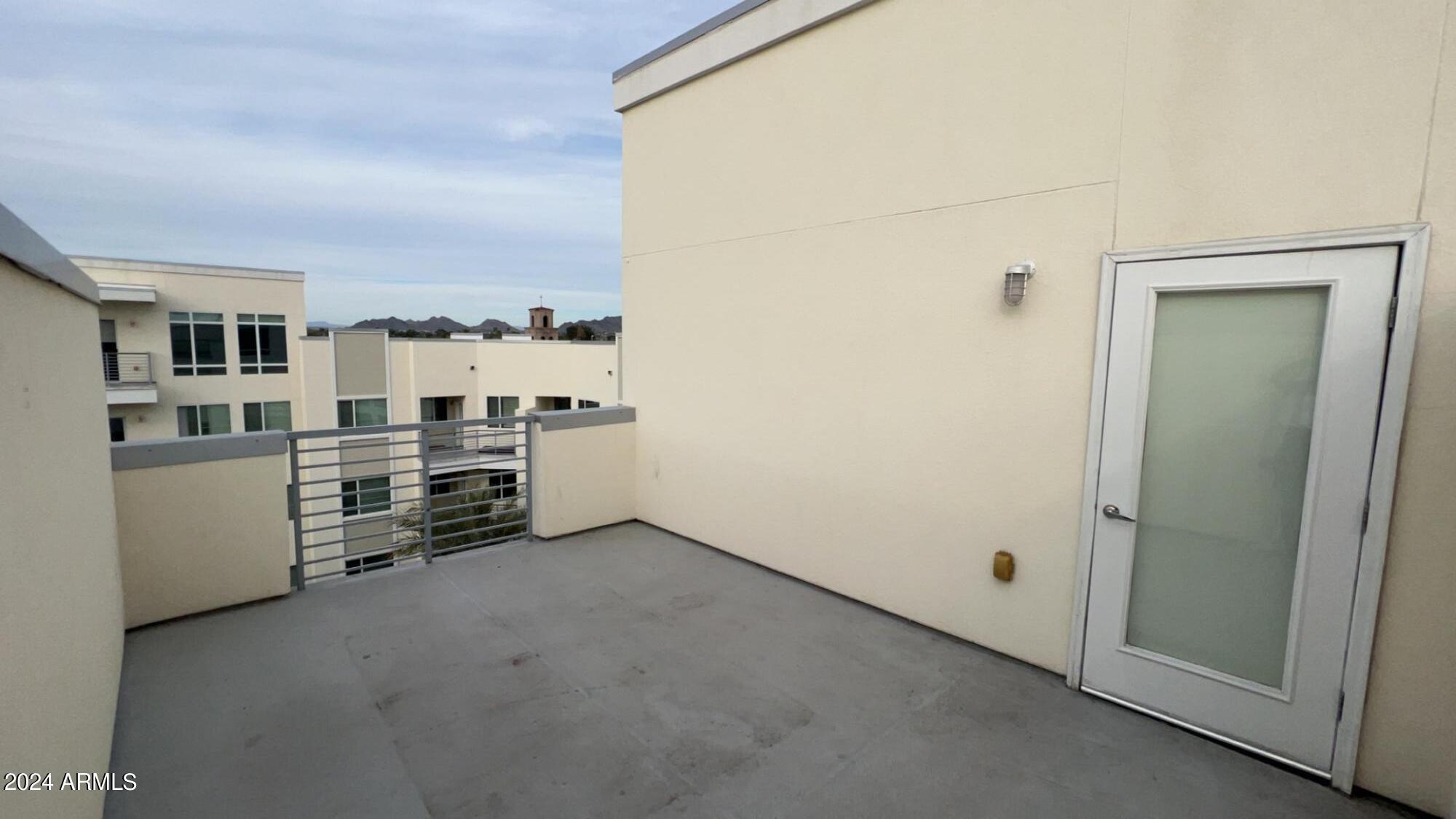 4949 North 7th Street, Unit A3 Phoenix, AZ 85014 - Photo 7 of 22 a view of a kitchen with refrigerator and stove