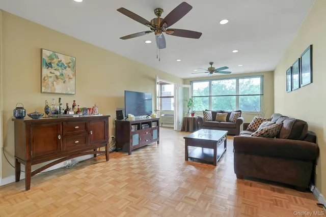 a living room with furniture and a window