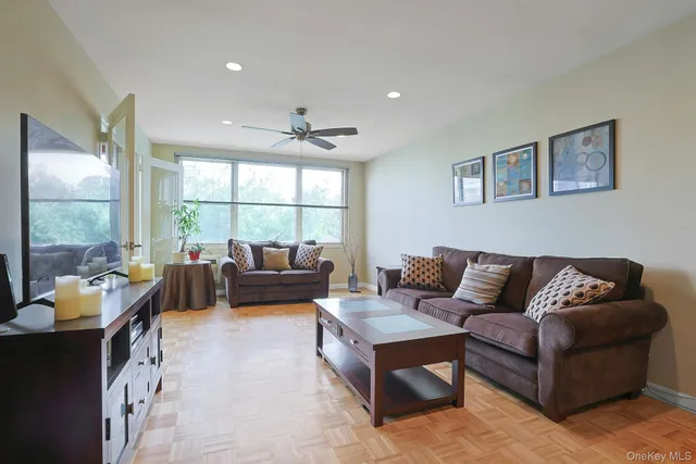 a living room with furniture and a large window
