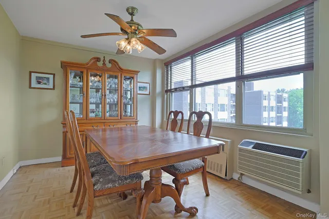 a view of a dining room with furniture wooden floor and a chandelier