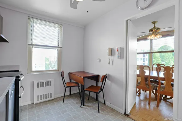 a view of a dining room with furniture window and outside view