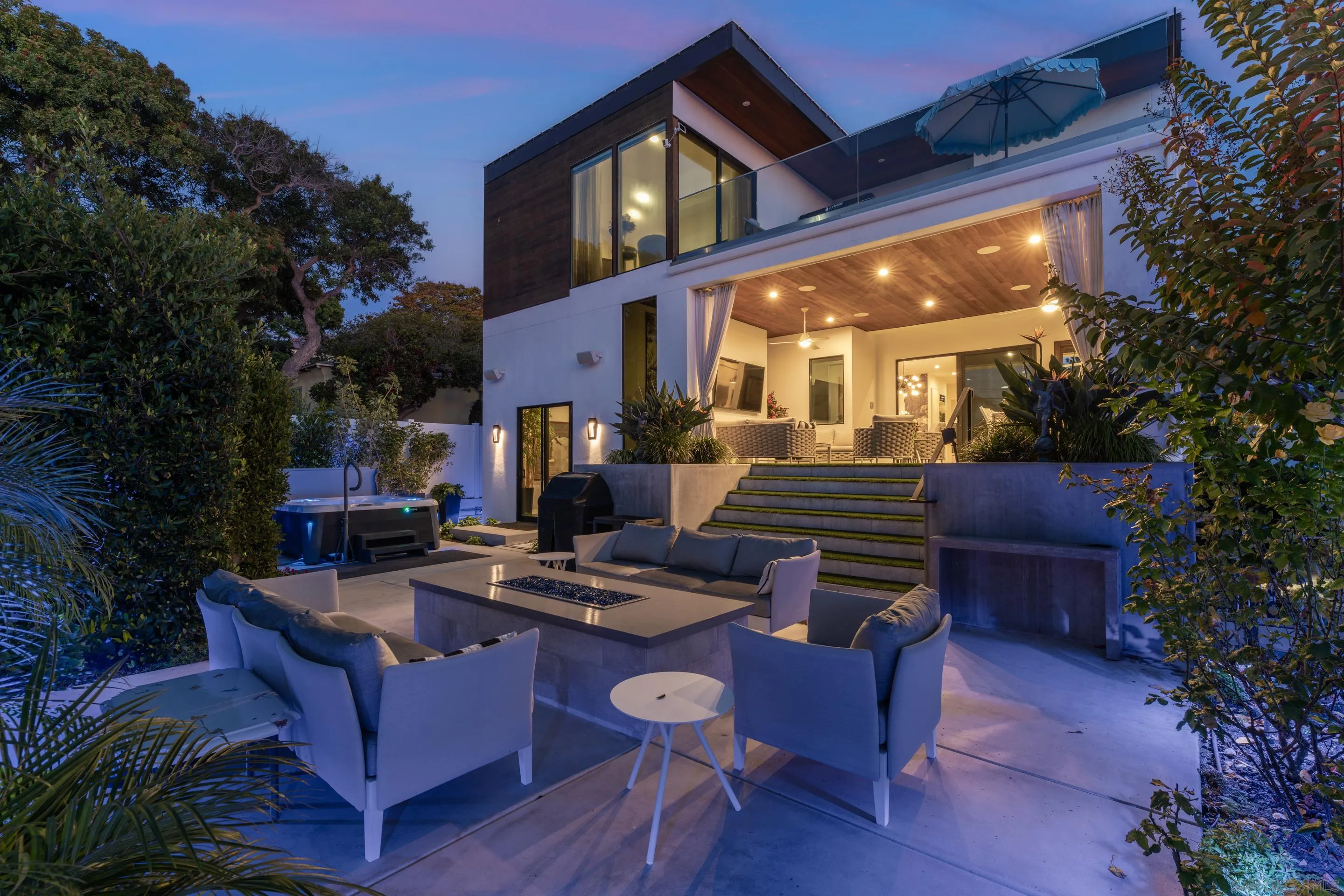 1224 Virginia Way La Jolla, CA 92037 - Photo 13 of 45 a view of a patio with couches table and chairs and potted plants
