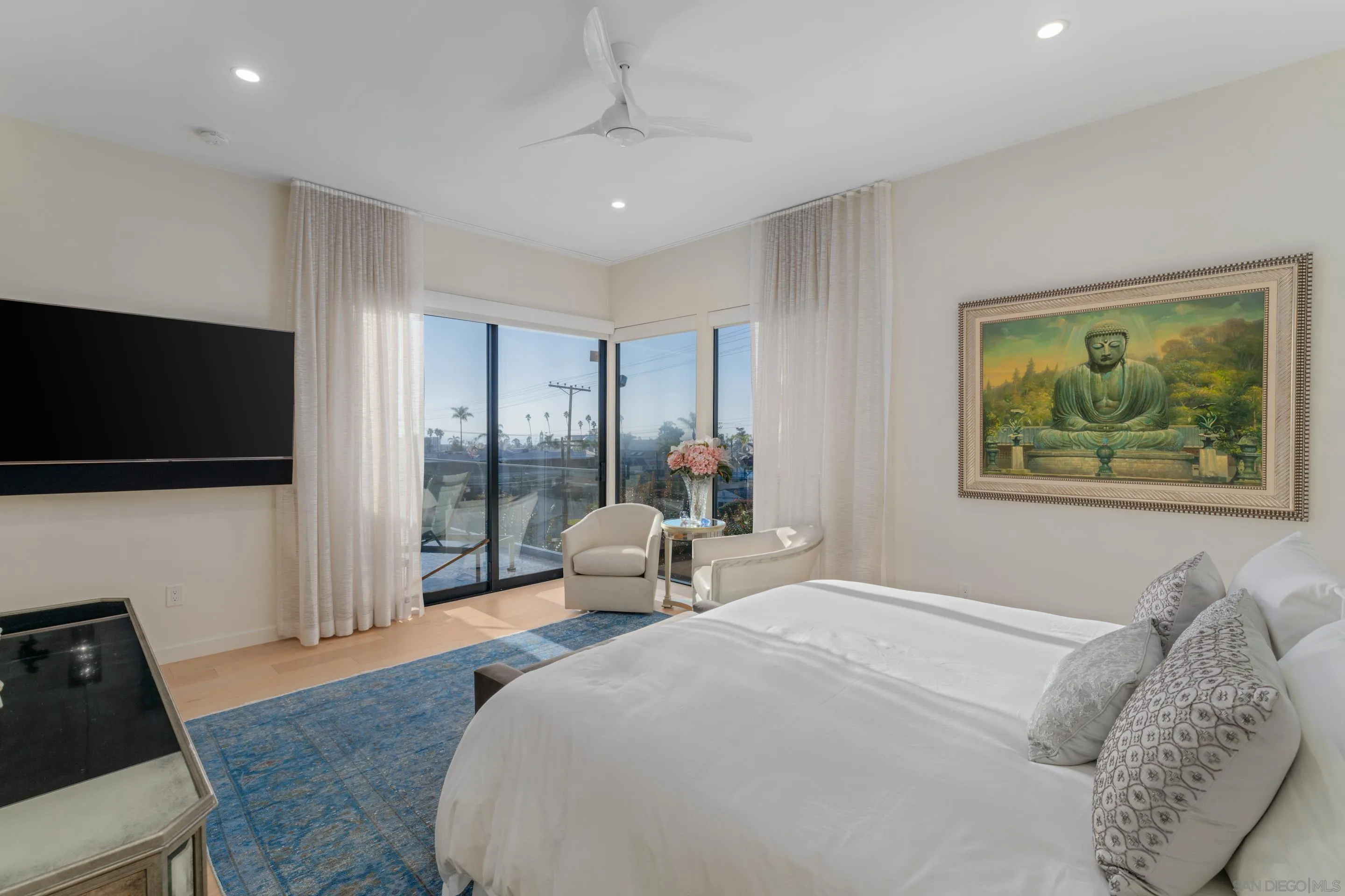 1224 Virginia Way La Jolla, CA 92037 - Photo 16 of 45 a bed room with a bed and a flat screen tv