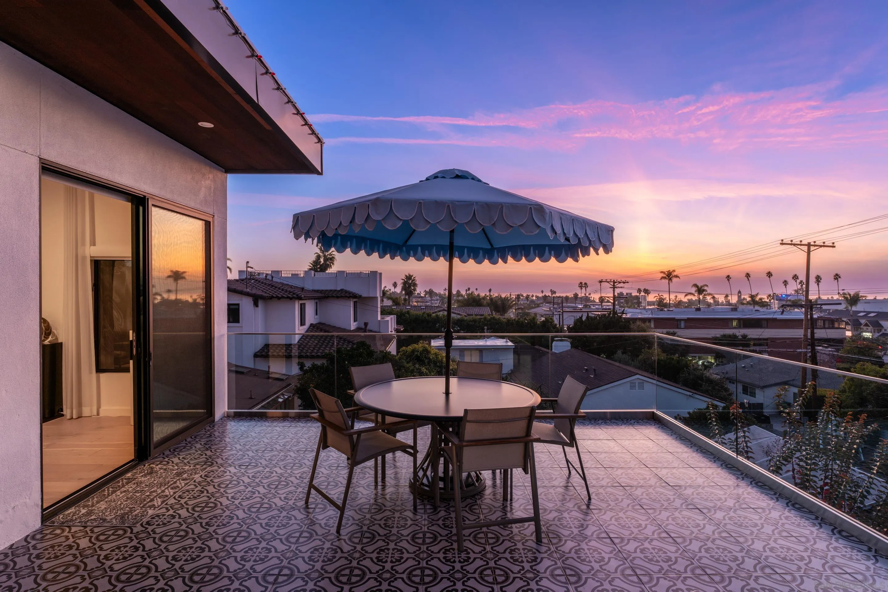 1224 Virginia Way La Jolla, CA 92037 - Photo 18 of 45 a view of a chairs and table under an umbrella in patio of a house