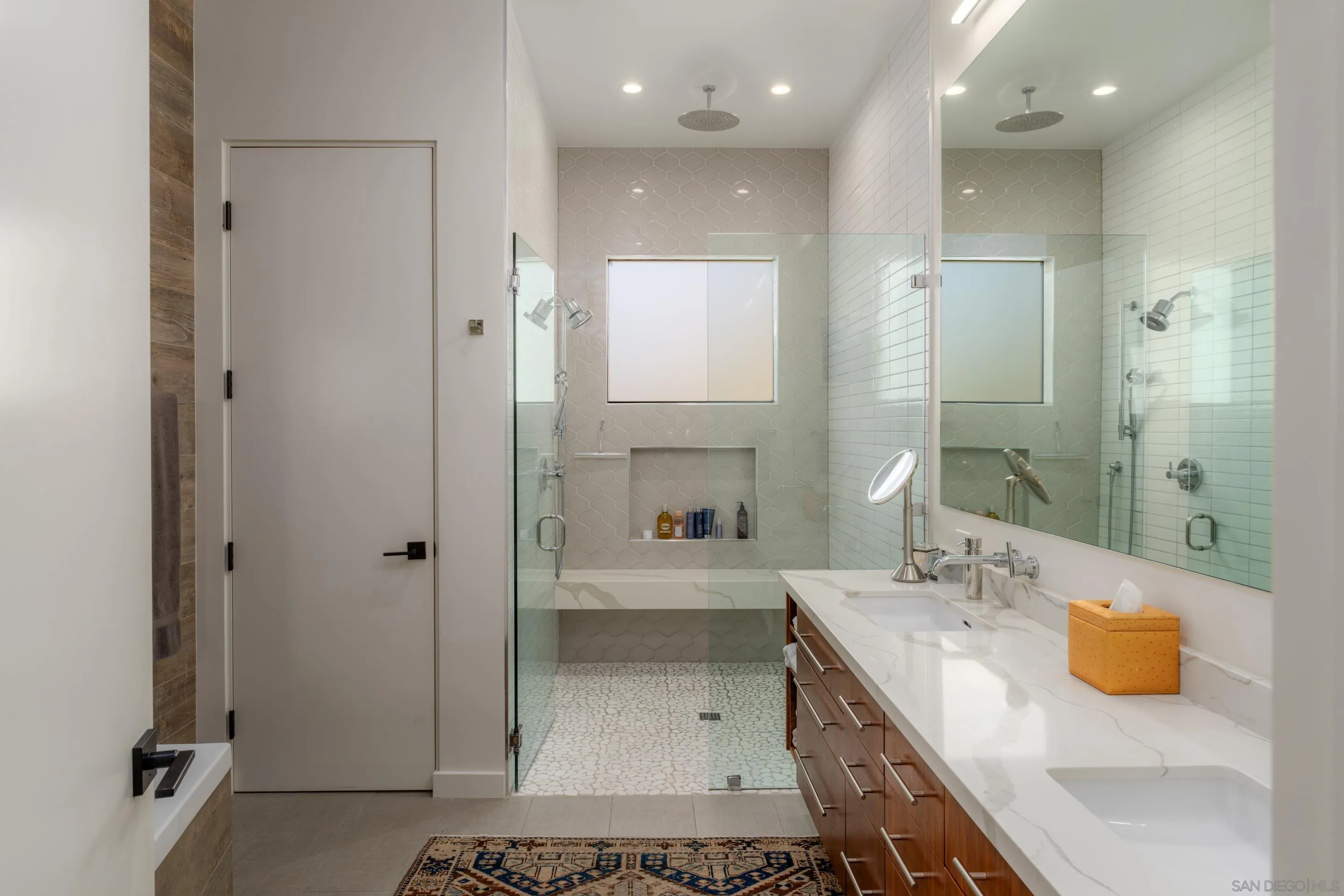 1224 Virginia Way La Jolla, CA 92037 - Photo 21 of 45 a bathroom with a granite countertop sink a shower and a mirror