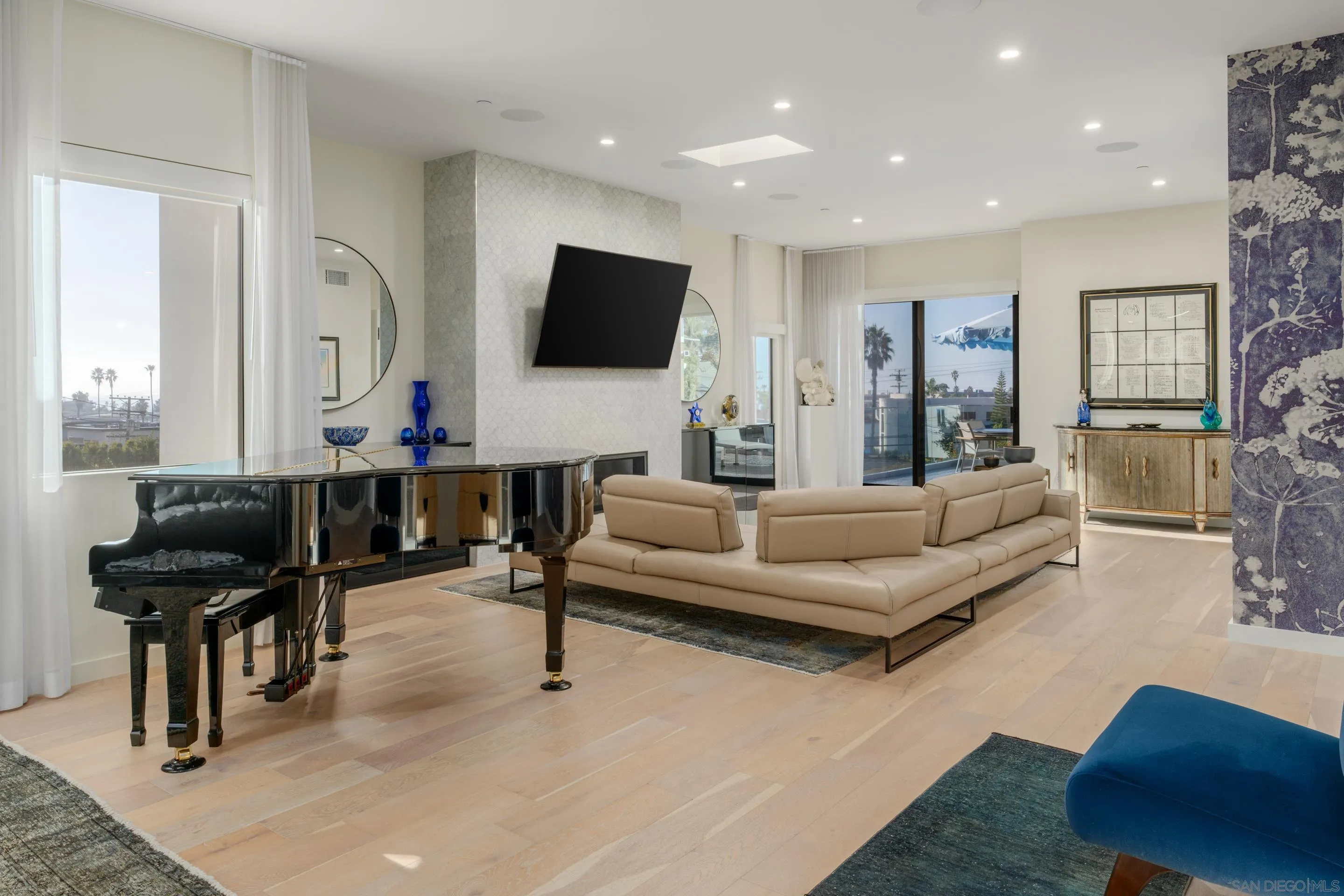 1224 Virginia Way La Jolla, CA 92037 - Photo 22 of 45 a living room with furniture and a flat screen tv