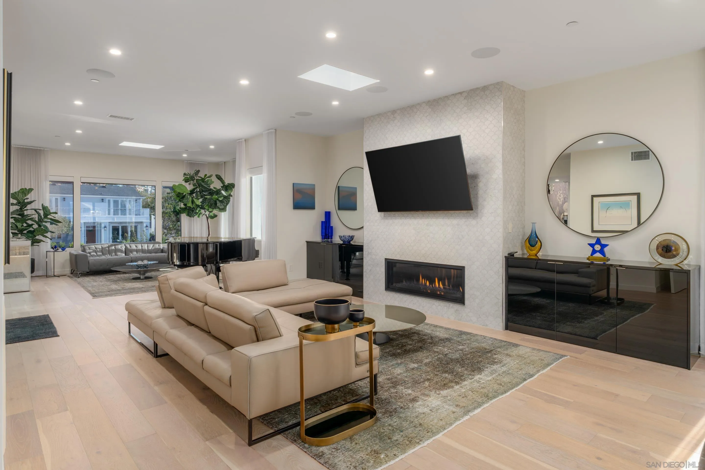 1224 Virginia Way La Jolla, CA 92037 - Photo 23 of 45 a living room with furniture a fireplace and a flat screen tv