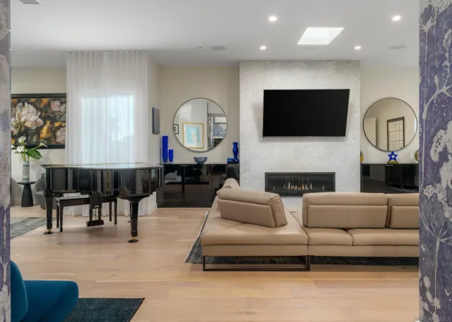 a living room with fireplace furniture and a flat screen tv
