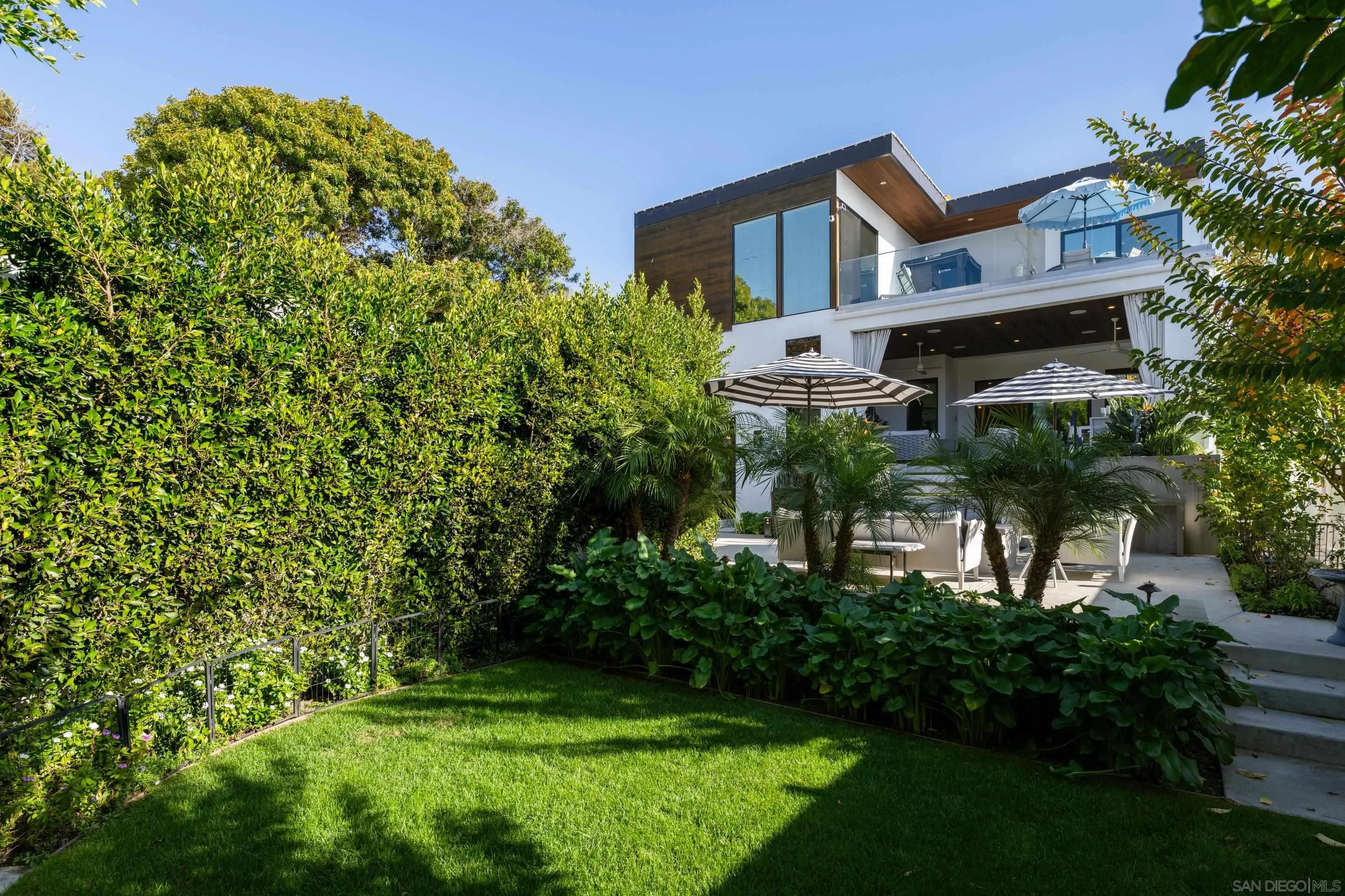 1224 Virginia Way La Jolla, CA 92037 - Photo 30 of 45 a view of a house with a yard and plants