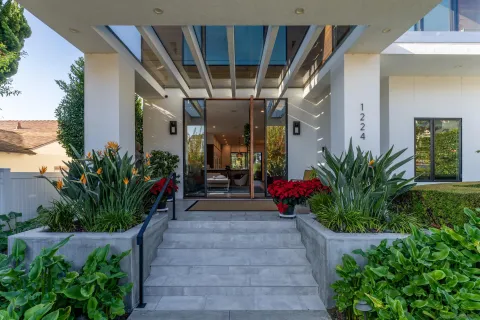 a view of lobby with a potted plant and flower plants