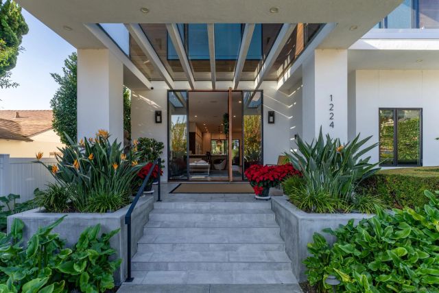 a view of lobby with a potted plant and flower plants