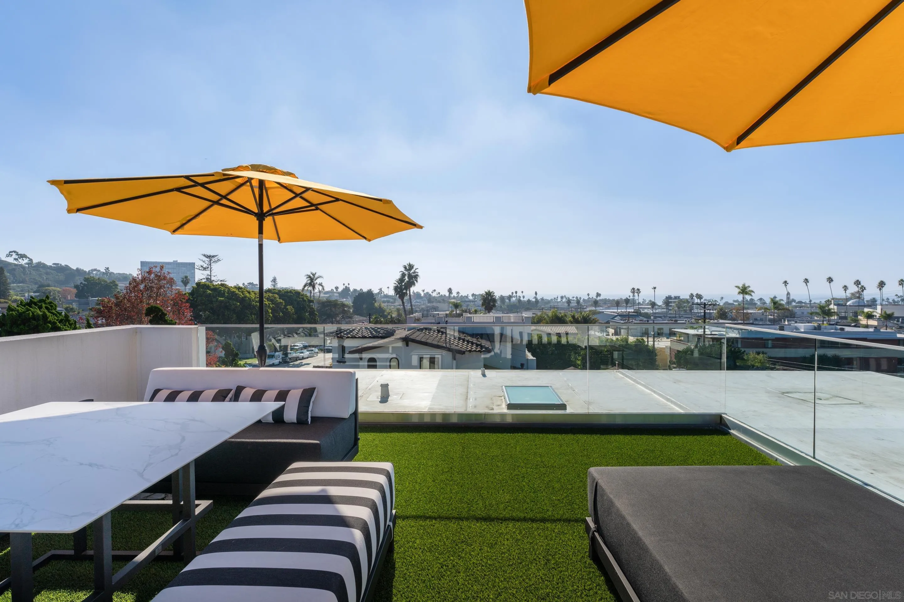 1224 Virginia Way La Jolla, CA 92037 - Photo 33 of 45 a view of a swimming pool with a patio