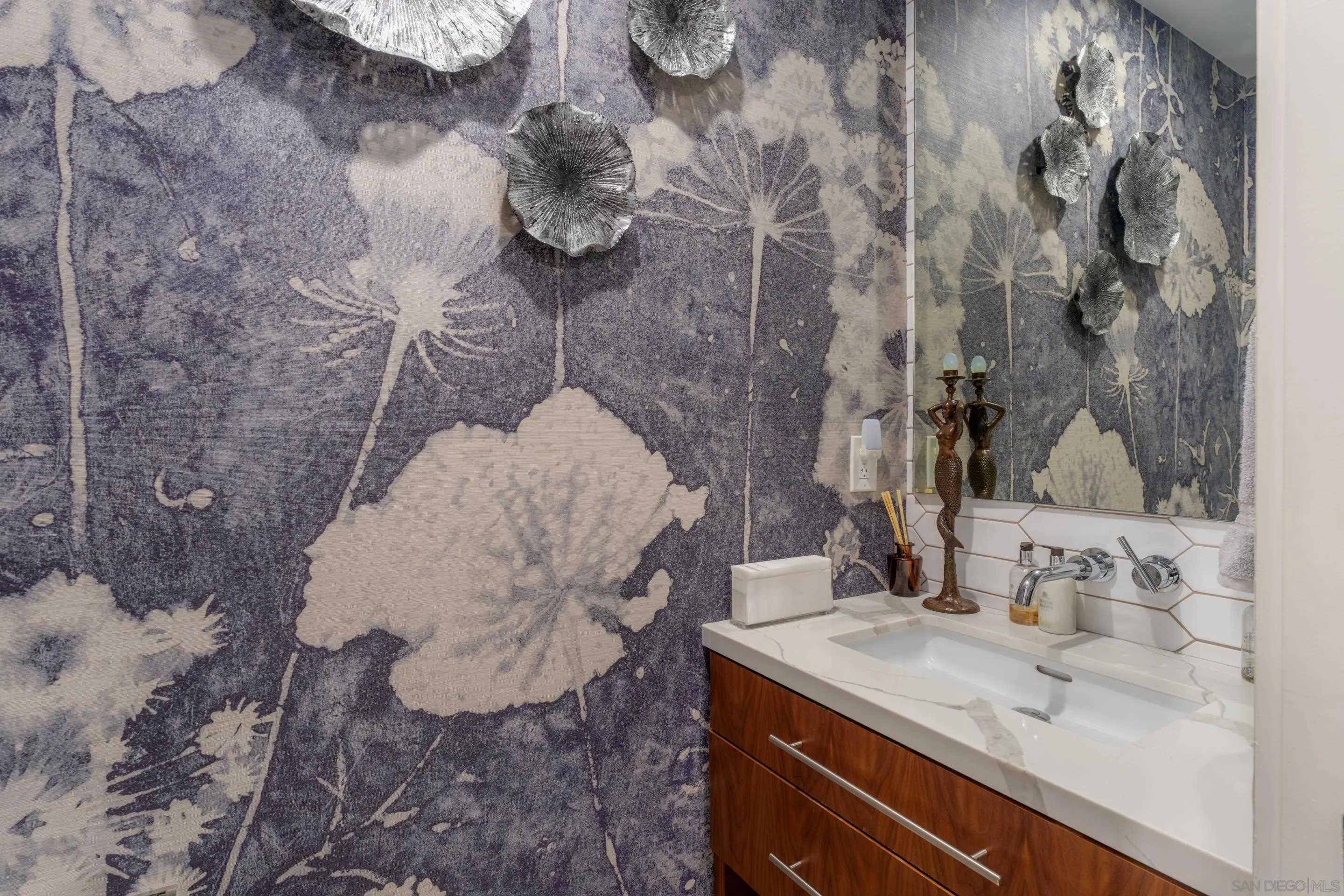 1224 Virginia Way La Jolla, CA 92037 - Photo 42 of 45 a bathroom with a sink and mirror