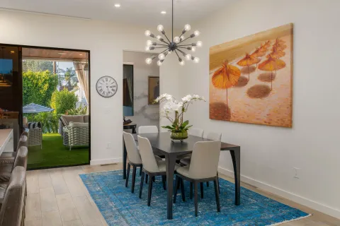 a dining room with furniture and window