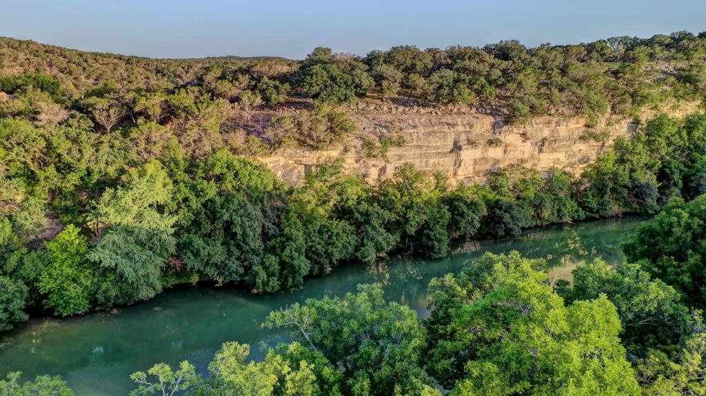157 Cedar Cliff Loop West Hunt, TX 78024 - Photo 25 of 35 a view of a garden with a building