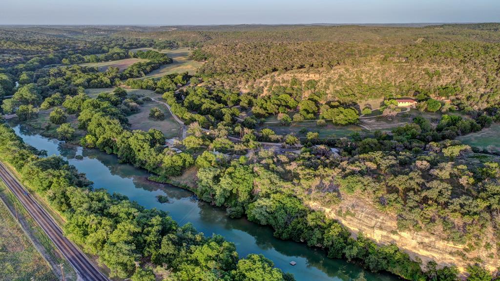 157 Cedar Cliff Loop West Hunt, TX 78024 - Photo 31 of 35 an aerial view of residential houses with outdoor space and trees