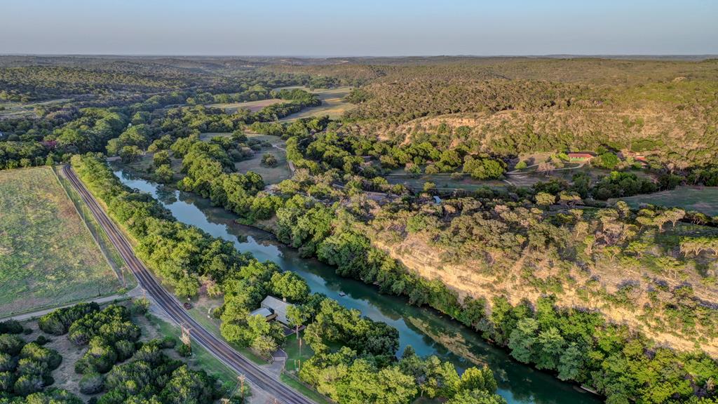 157 Cedar Cliff Loop West Hunt, TX 78024 - Photo 32 of 35 an aerial view of residential houses with outdoor space and trees