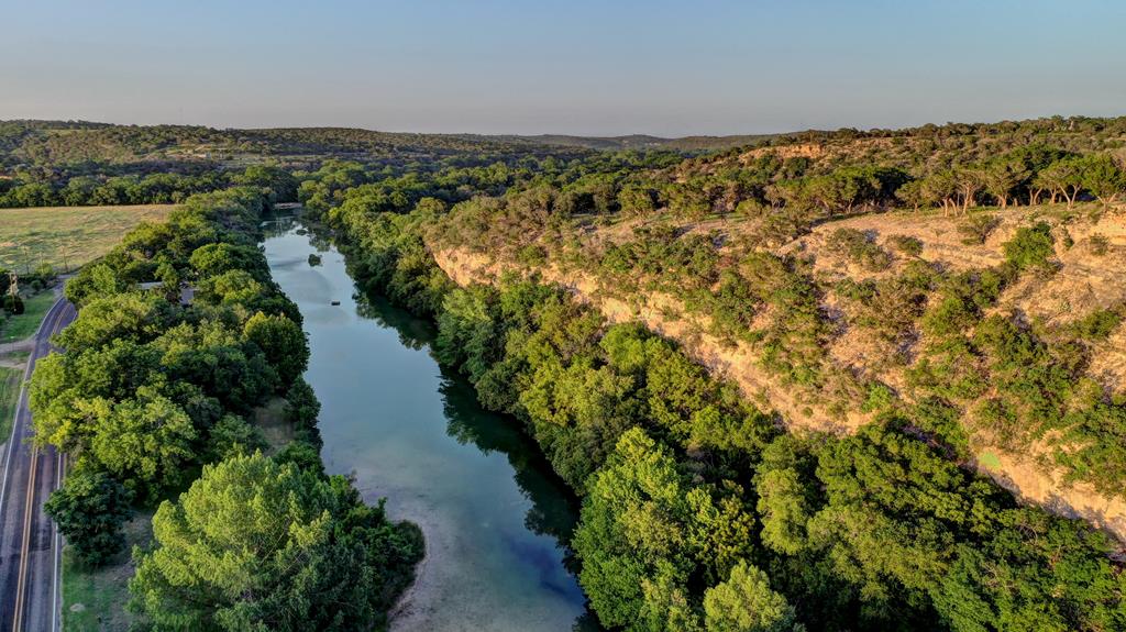 157 Cedar Cliff Loop West Hunt, TX 78024 - Photo 33 of 35 a view of a lake with houses