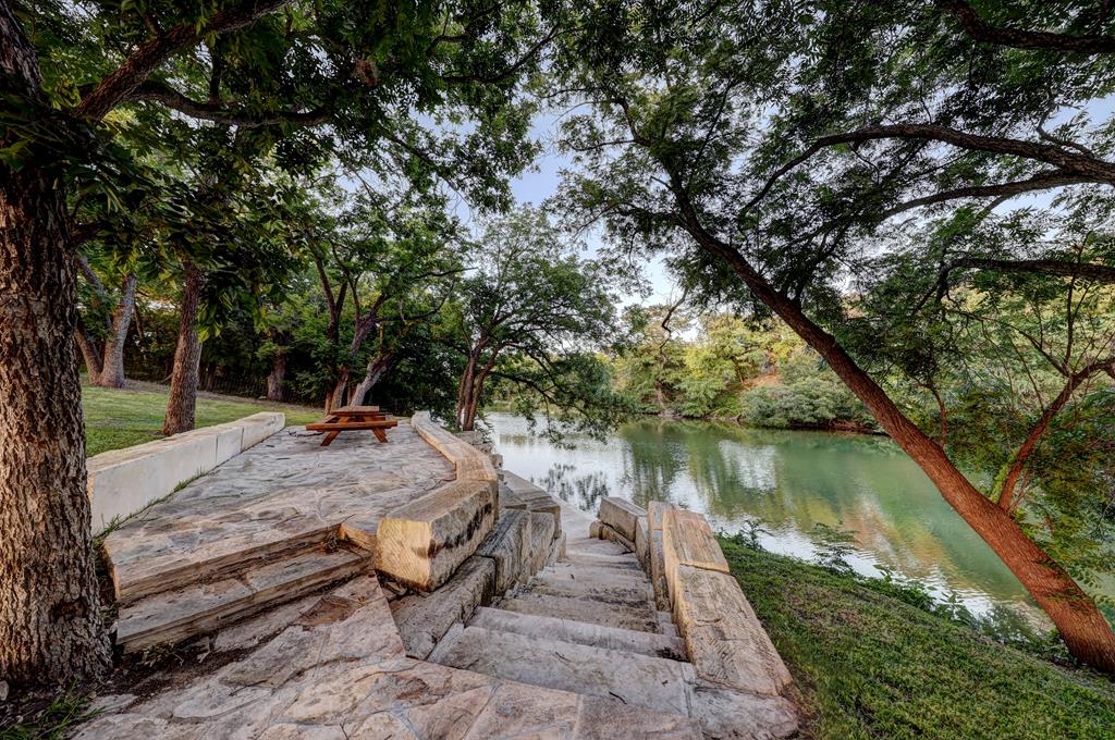 157 Cedar Cliff Loop West Hunt, TX 78024 - Photo 10 of 35 a view of a lake with a yard