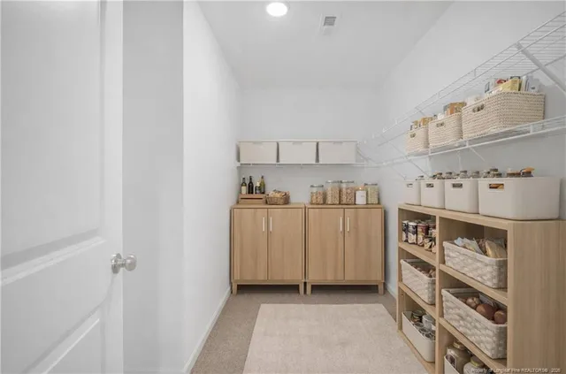 a kitchen with cabinets and window