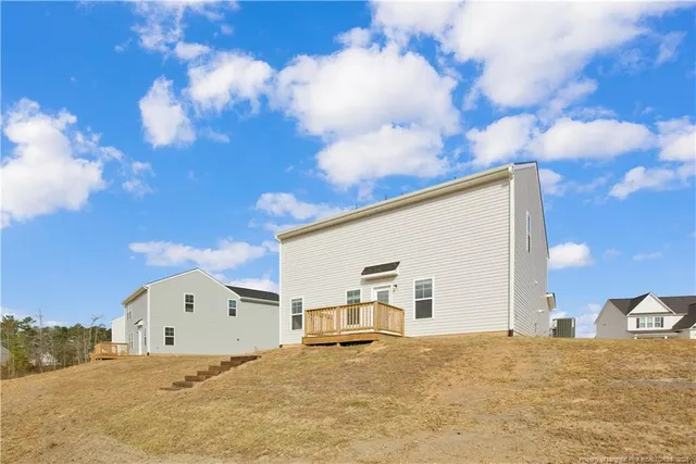 a view of white house with a snow in the background