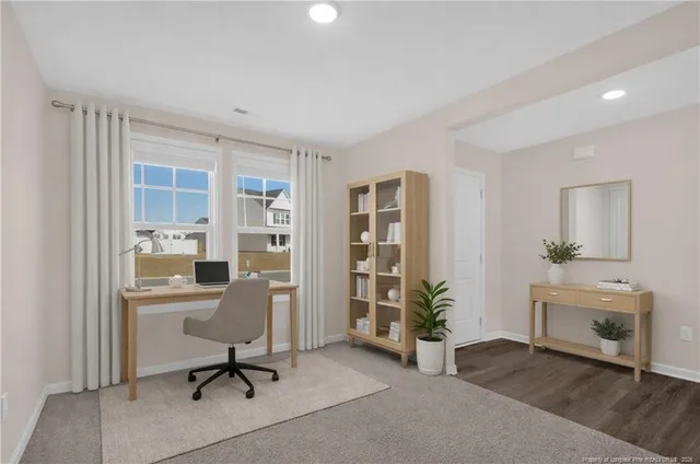 a view of a livingroom with furniture and a window
