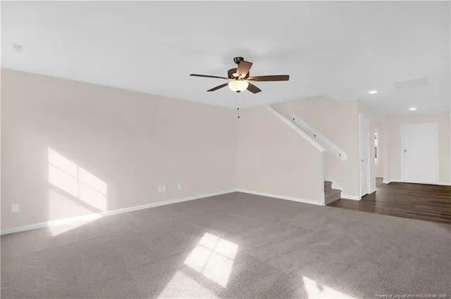 a view of a big room with carpet