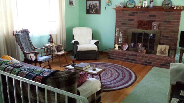 117 Hoffman Road Wind Gap, PA 18091 - Photo 3 of 15 a living room with furniture and a fireplace
