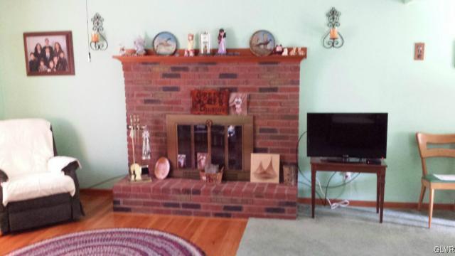 117 Hoffman Road Wind Gap, PA 18091 - Photo 4 of 15 a living room with furniture and a fireplace