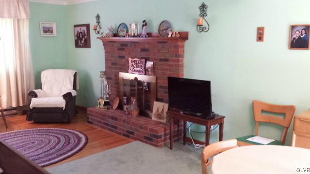 117 Hoffman Road Wind Gap, PA 18091 - Photo 5 of 15 a living room with furniture and a fireplace