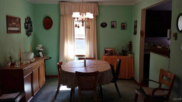 117 Hoffman Road Wind Gap, PA 18091 - Photo 6 of 15 a view of a dining room with furniture and chandelier