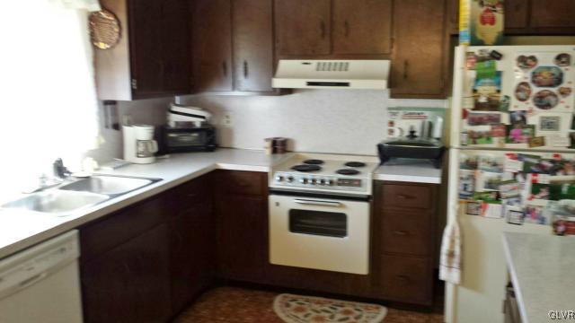 117 Hoffman Road Wind Gap, PA 18091 - Photo 7 of 15 a kitchen with stainless steel appliances a stove a sink and a refrigerator