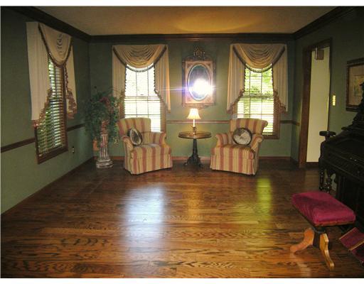 323 Blue Run Road Cheswick, PA 15024 - Photo 7 of 13 Living Room. Formal living room with hardwood floors and crown molding.