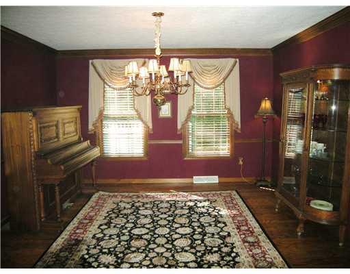 323 Blue Run Road Cheswick, PA 15024 - Photo 8 of 13 Dining Room. Dining room with hardwood floors, crown and chair rail.