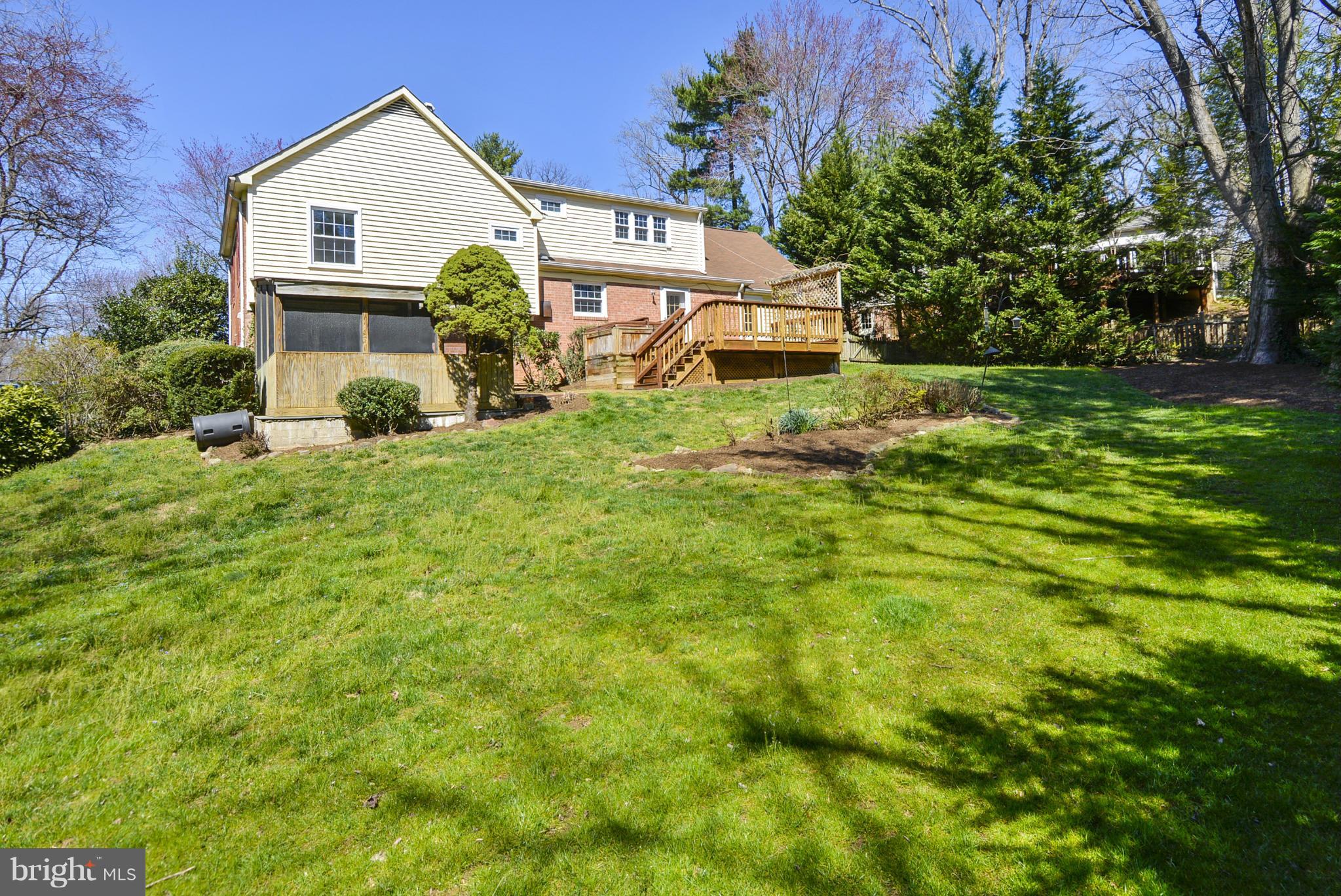 1954 Foxhall Road McLean, VA 22101 - Photo 2 of 30 a front view of a house with yard and green space