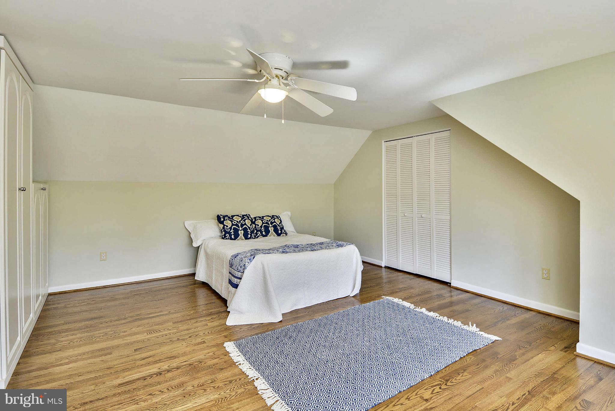 1954 Foxhall Road McLean, VA 22101 - Photo 11 of 30 a bedroom with a bed and wooden floor