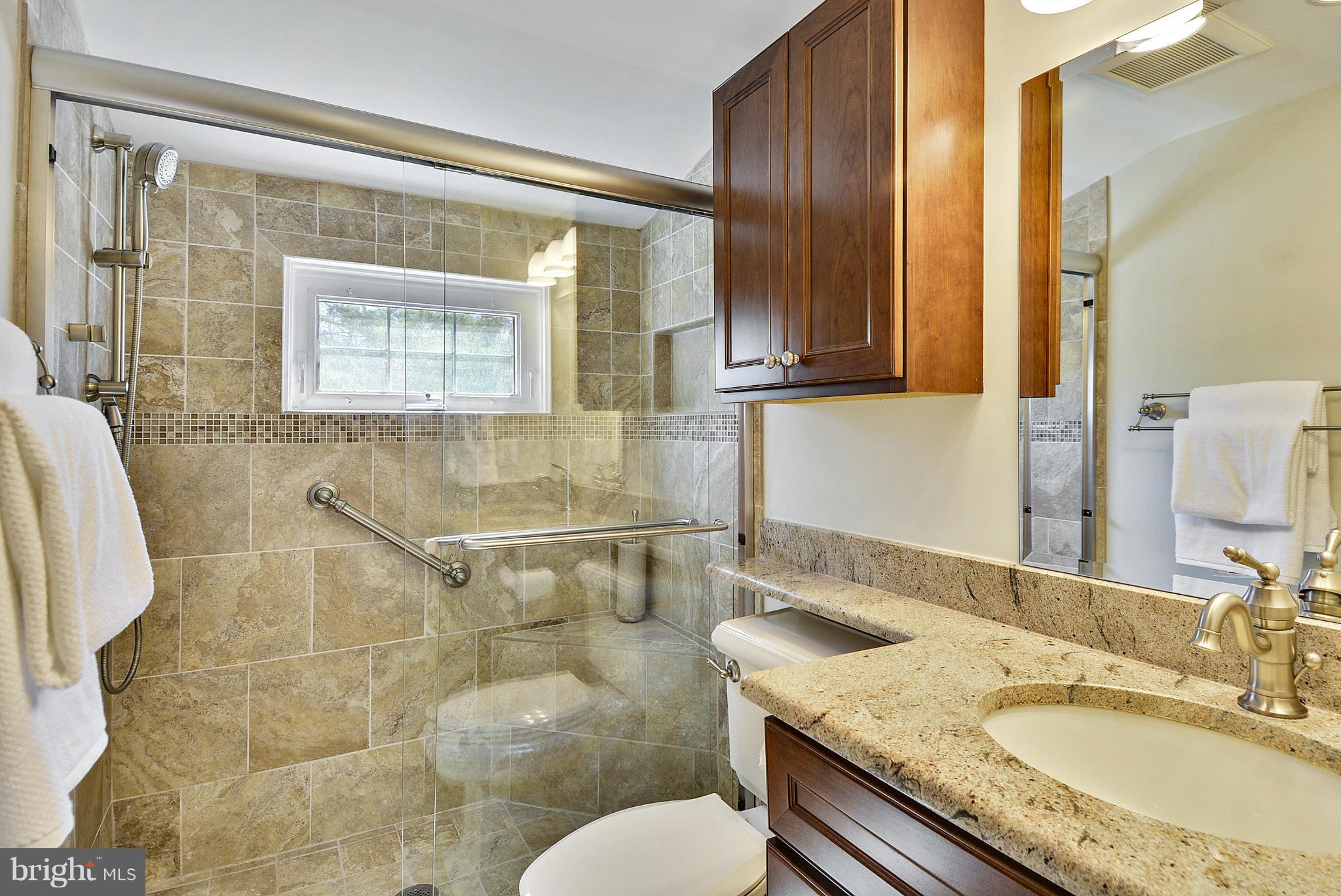 1954 Foxhall Road McLean, VA 22101 - Photo 14 of 30 a bathroom with a granite countertop sink and a mirror