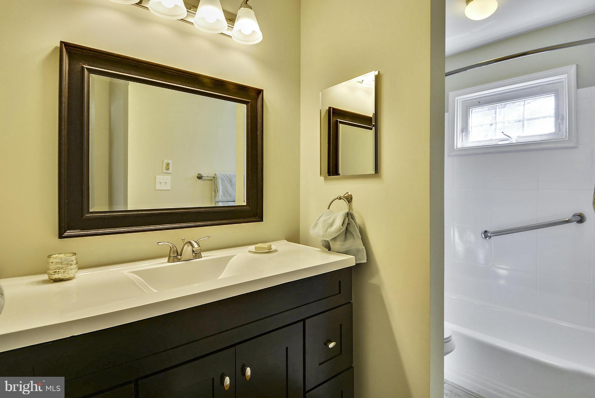 1954 Foxhall Road McLean, VA 22101 - Photo 18 of 30 a bathroom with 2 sink and a mirror