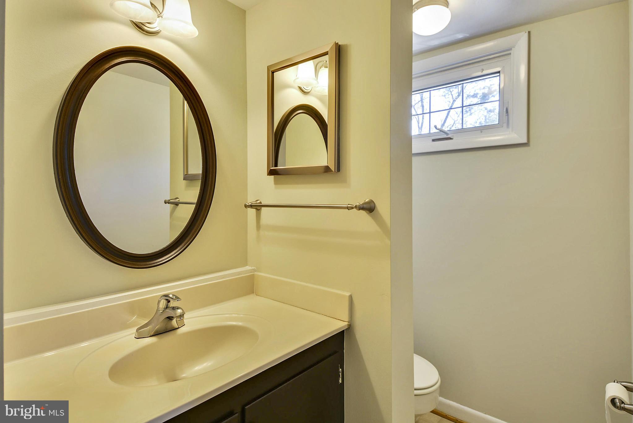 1954 Foxhall Road McLean, VA 22101 - Photo 21 of 30 a bathroom with a sink a toilet and a mirror