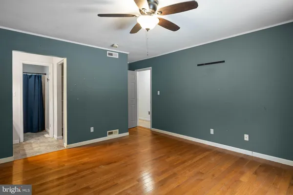 a bathroom with a sink vanity granite and a mirror