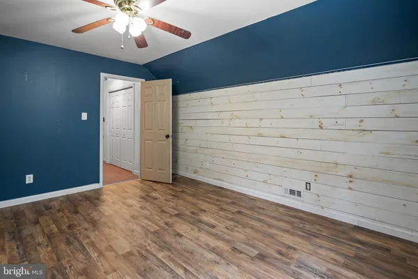 a bathroom with a sink a mirror and toilet