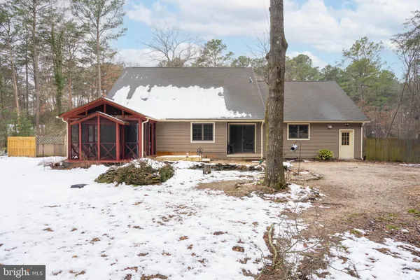 a view of a house with a floor to ceiling windows