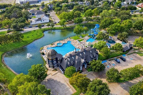 an aerial view of a house with a lake view