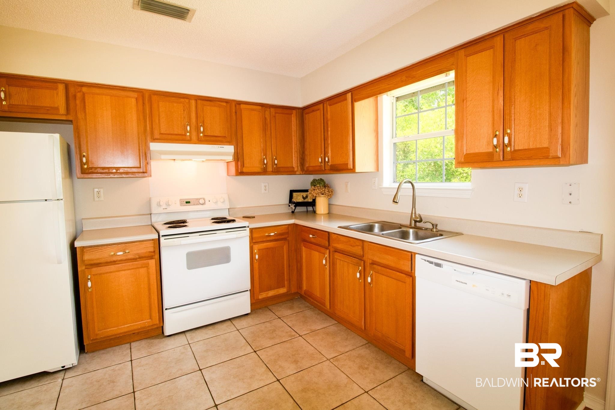 13255 Pointer Drive West Foley, AL 36535 - Photo 13 of 25 Kitchen featuring sink, white appliances, and light tile patterned floors