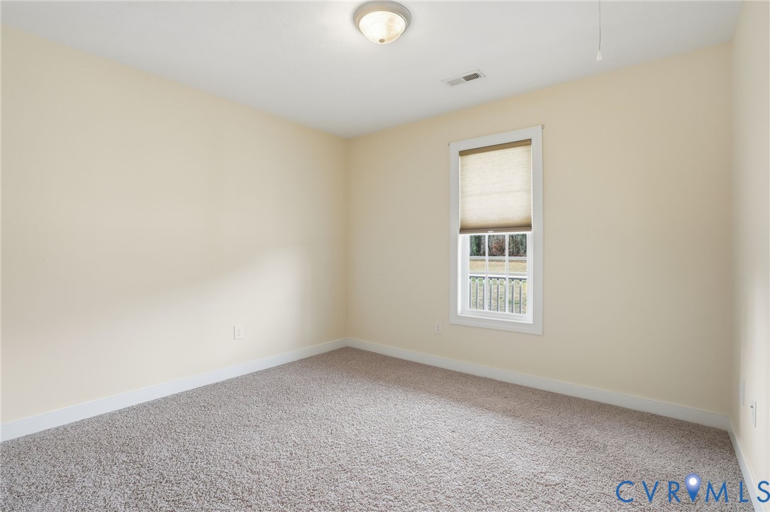 1220 Walkerton Road Walkerton, VA 23177 - Photo 20 of 33 a view of an empty room with a window