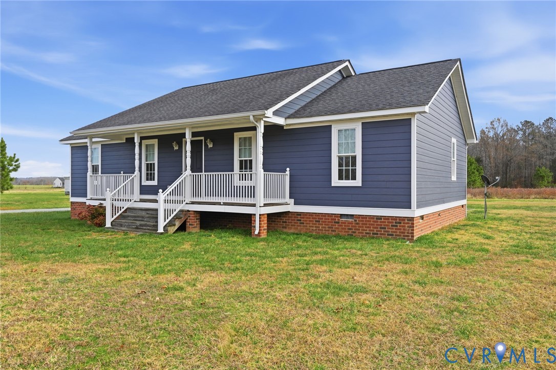 1220 Walkerton Road Walkerton, VA 23177 - Photo 2 of 33 a front view of a house with a yard