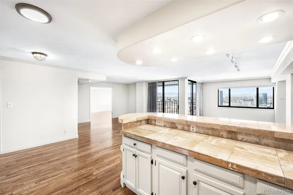 a view of a kitchen counter top space and wooden floor