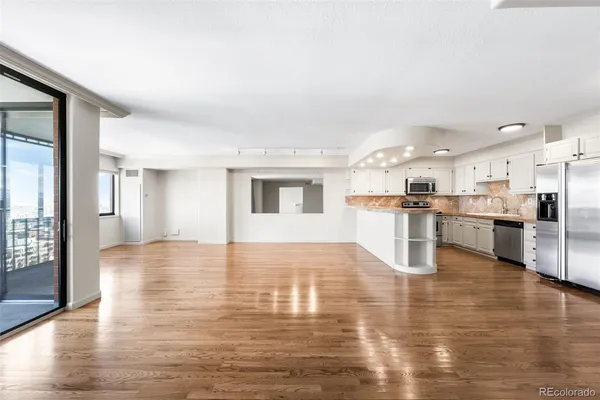 a view of kitchen with wooden floor
