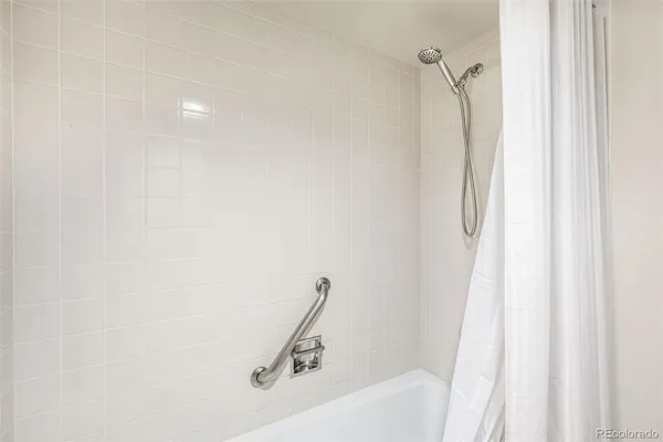a bathroom with a bath tub and a shower